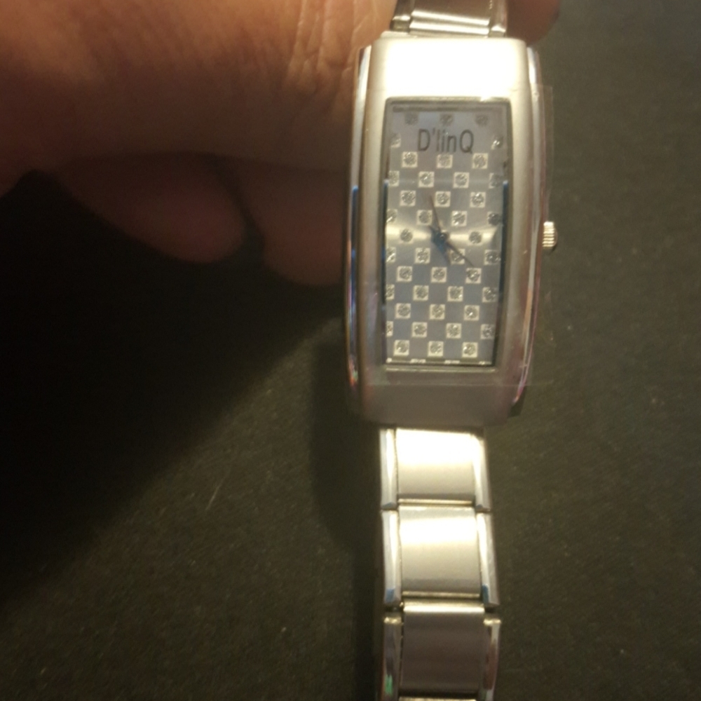 Stainless steel charm watch.